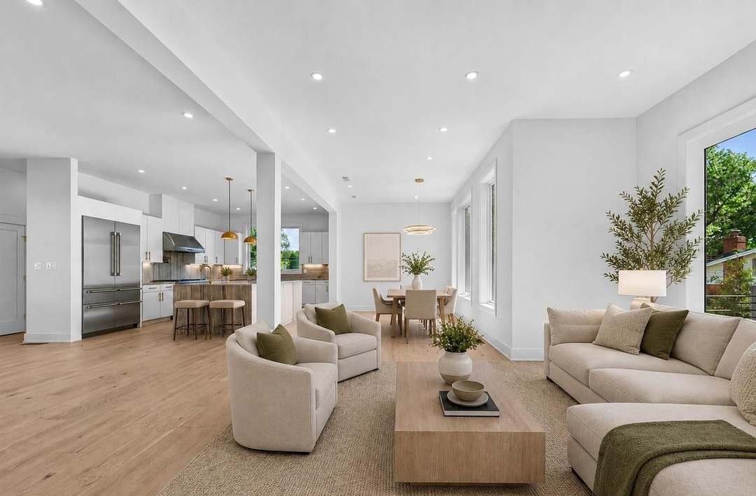 Open living room and kitchen staged for a real estate photo shoot
