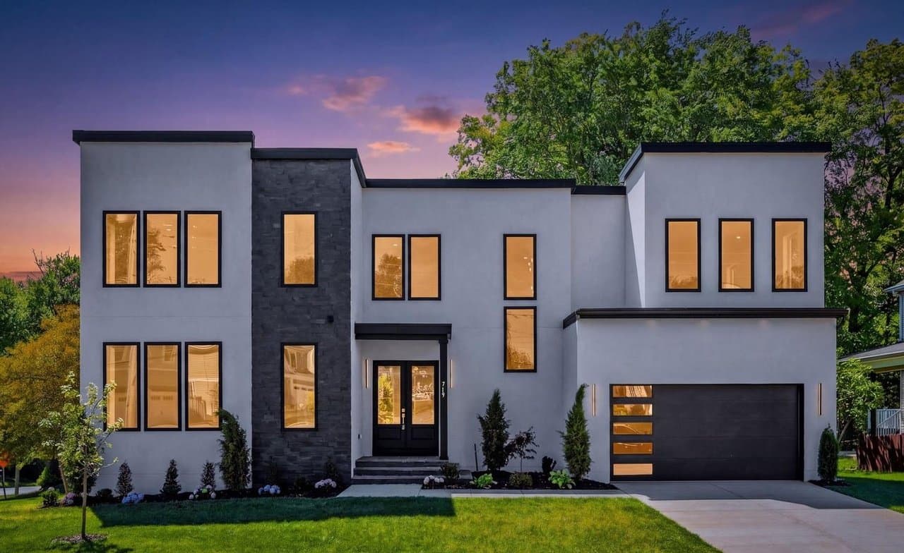 Twilight exterior photograph of a modern luxury home